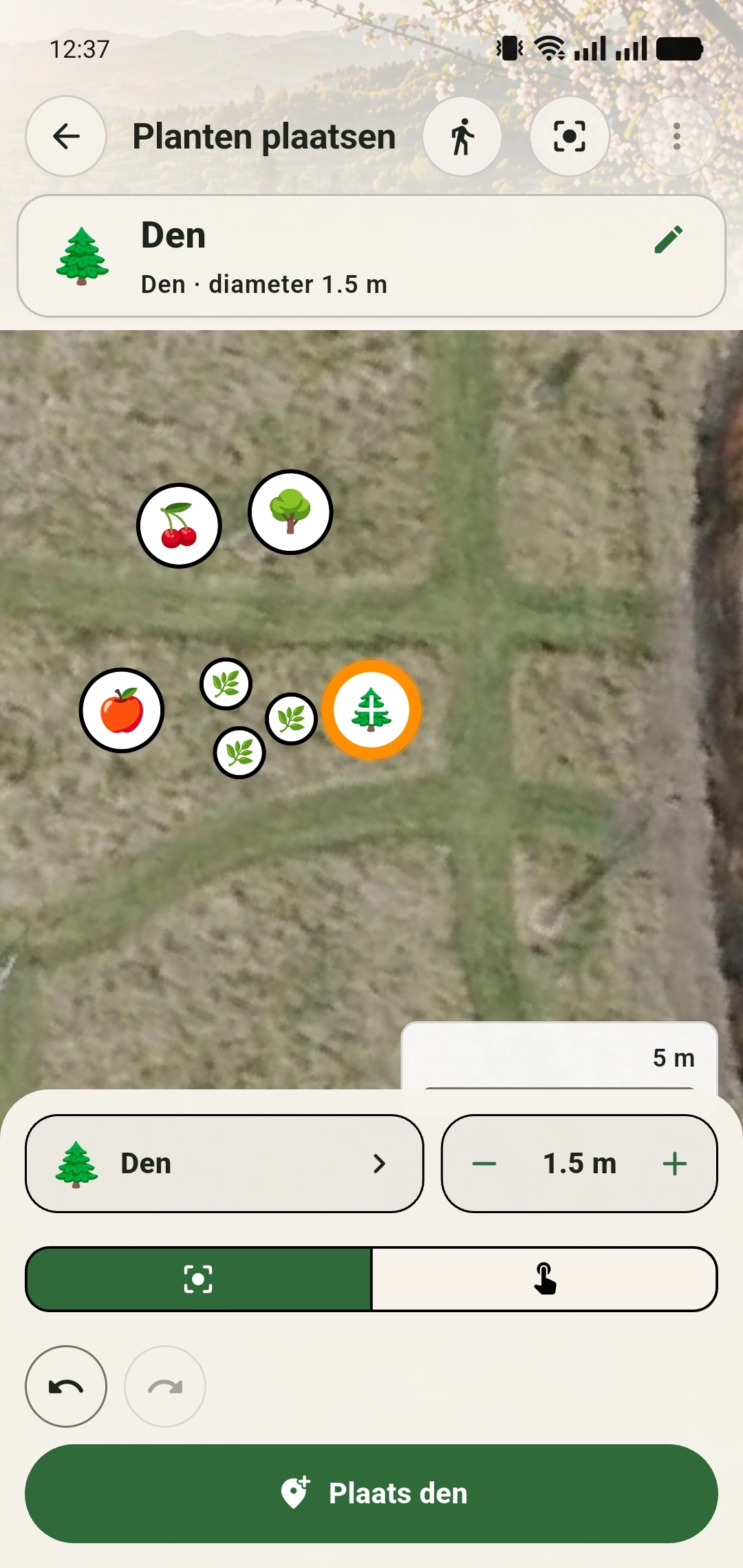 Voorbeeld van een Den als geselecteerd planticoon met oranje plaatsmarkering op de luchtfoto