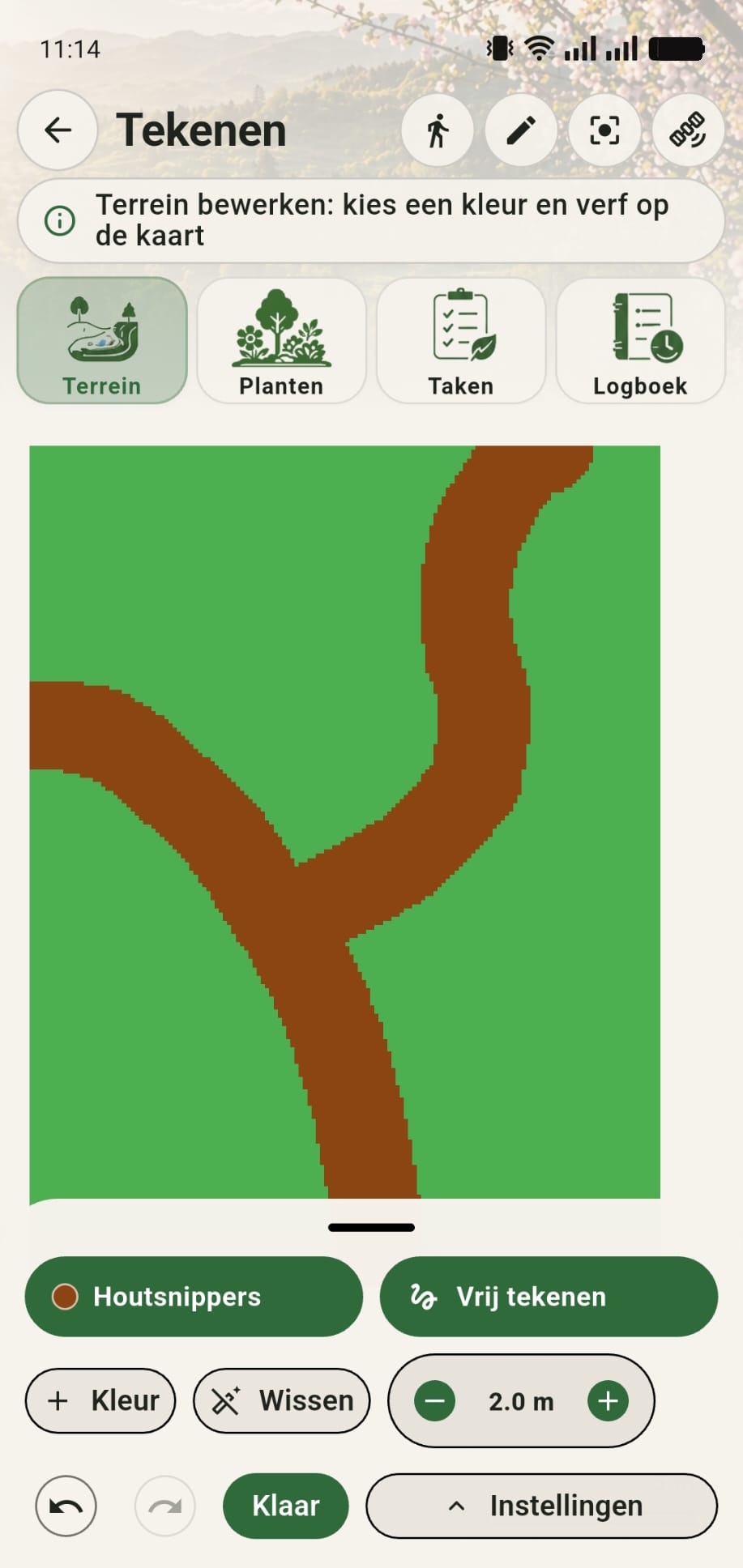 GreenPlot canvas met houtsnipperpaden op een groene grasondergrond